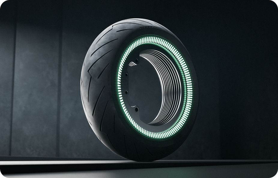 A futuristic motorcycle tire with an illuminated green LED ring on the sidewall, displayed standing upright against a dark background. The tire features a sleek design with grooves and a smooth black finish.